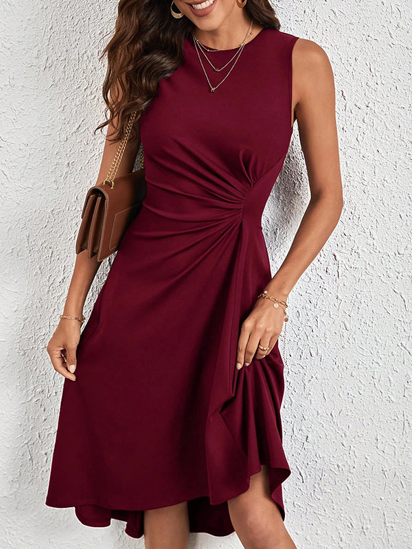 Robe mi-longue asymétrique plissée coupe trapèze, taille haute, à empiècements, à col rond, couleur unie