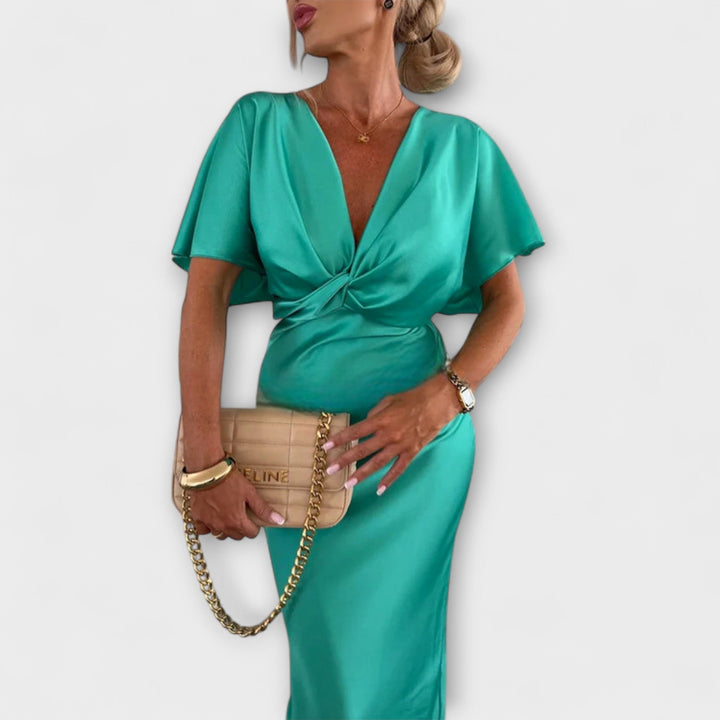 Sable - Robe maxi à décolleté en V avec nœud croisé et coupe ajustée en satin de haute qualité