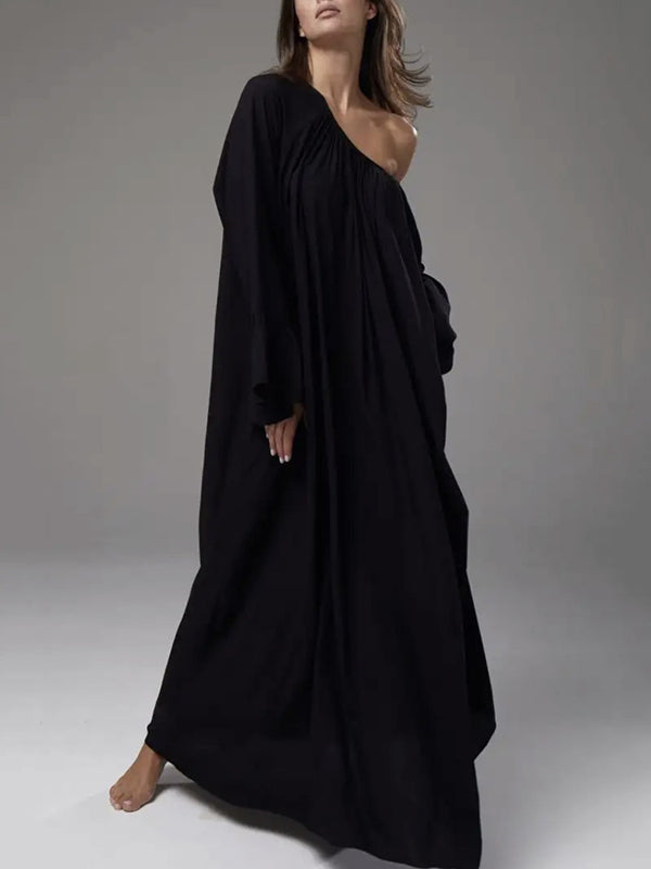 Robe longue plissée coupe trapèze, à manches évasées, à empiècements, à col rond, couleur unie