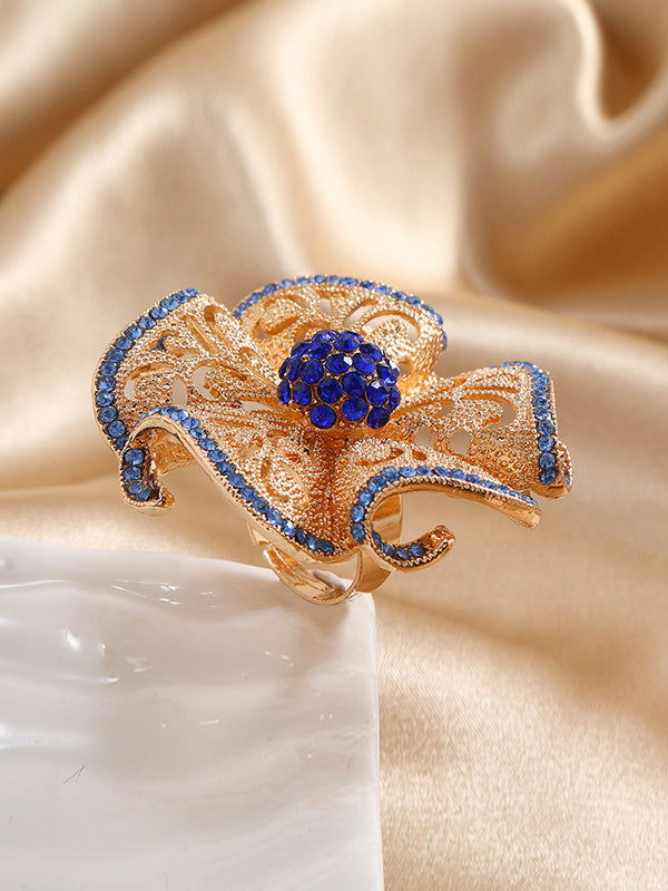 Bague réglable ajourée en forme de fleur, à strass