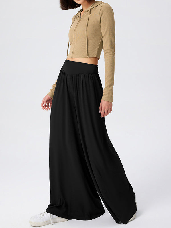 Pantalon ample plissé taille haute, à poches, à empiècements, couleur unie
