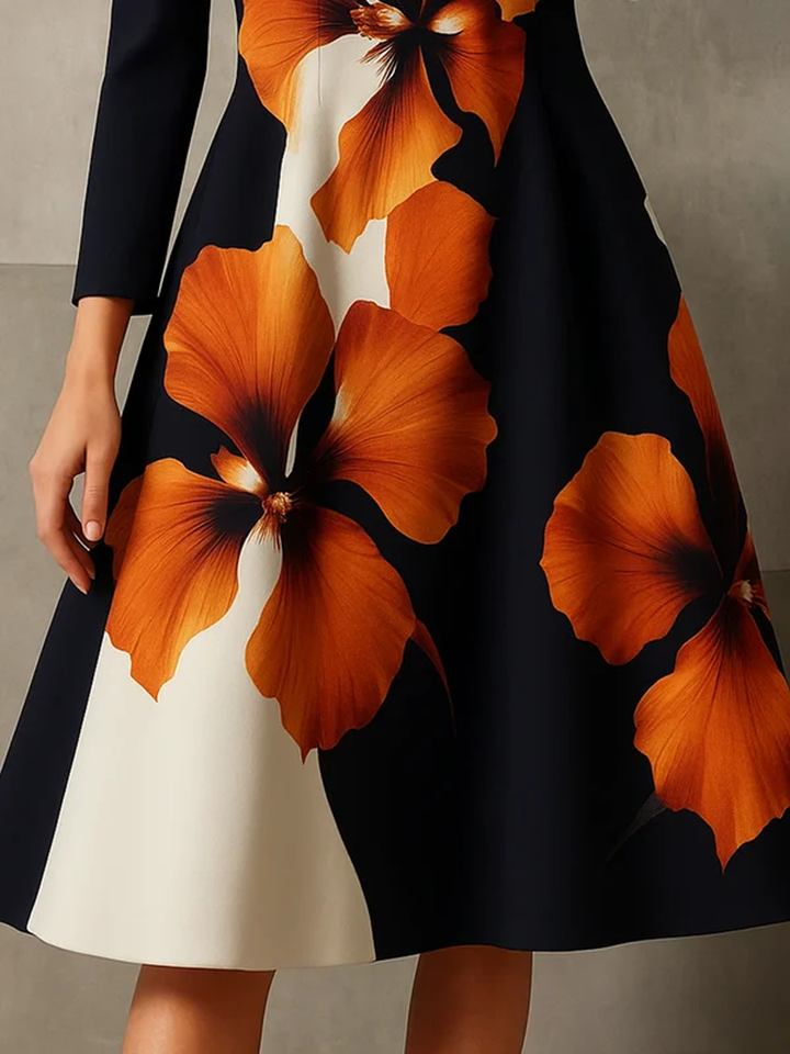 Robe mi-longue coupe trapèze, à manches longues, à imprimé floral, à col cheminée, couleur contrastée