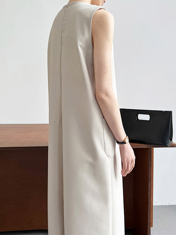 Robe mi-longue ample fendue dans le dos taille haute, à poches, à fermeture éclair, à col rond, couleur unie