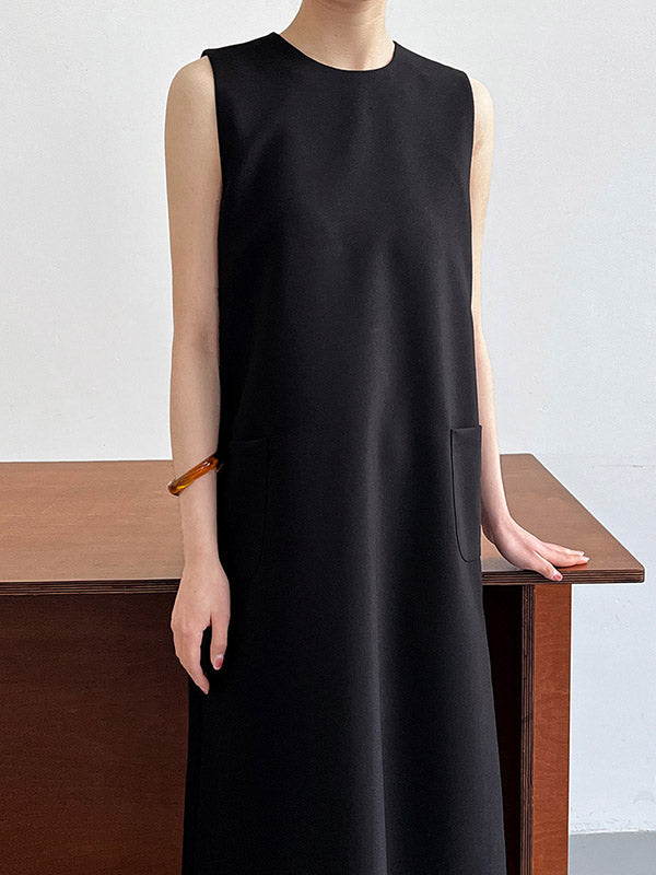 Robe mi-longue ample fendue dans le dos taille haute, à poches, à fermeture éclair, à col rond, couleur unie