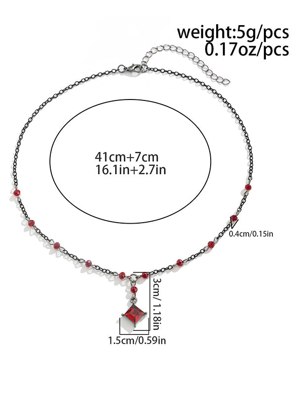 Collier géométrique à pompons