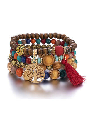 Bracelet bohémien multicouche en perles de bois fait à la main avec pompons