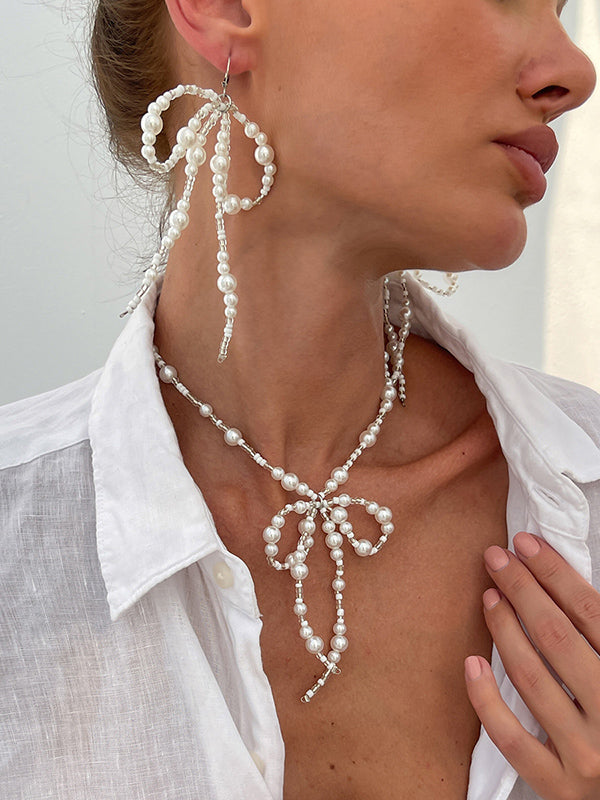Parure boucles d'oreilles pendantes et collier à nœud