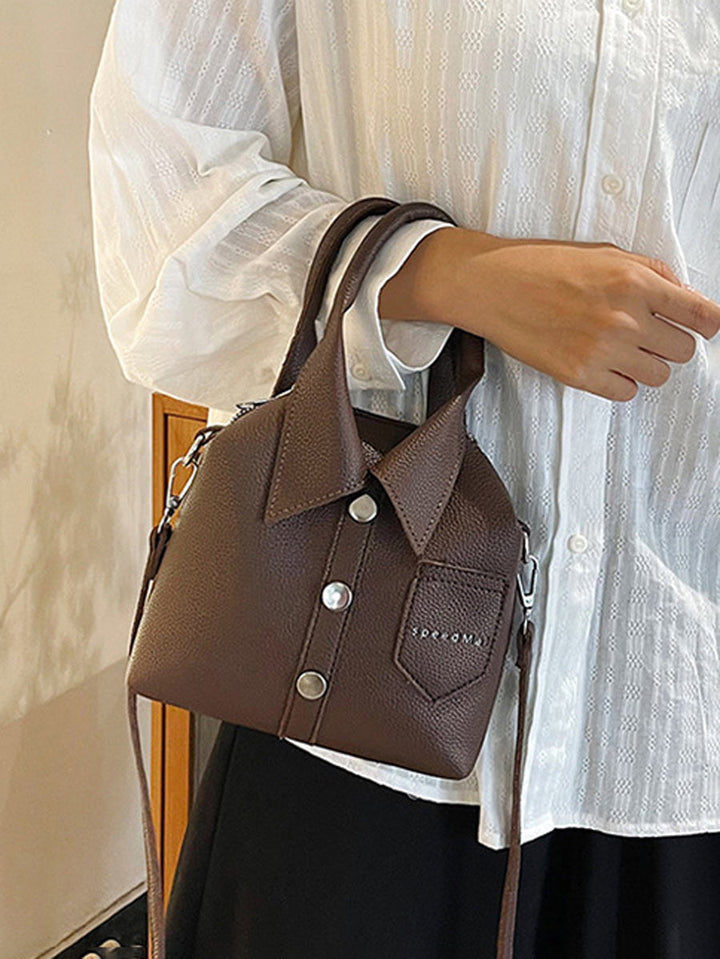 Sac à main bandoulière géométrique boutonné couleur unie