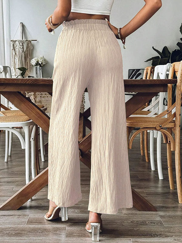 Pantalon ample plissé à jambes larges, à taille élastique, à poches, à empiècements, couleur unie