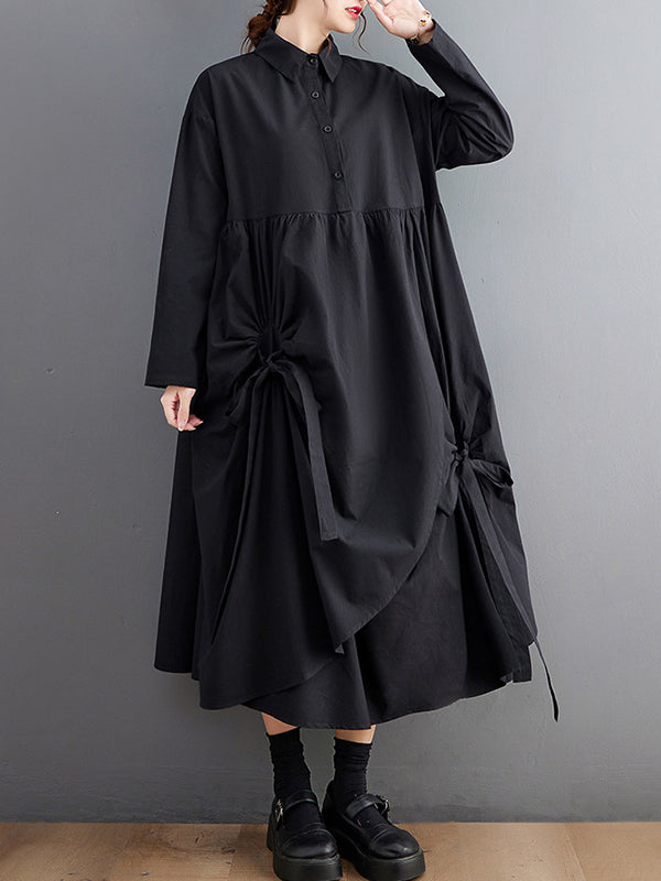 Robe chemise boutonnée plissée nouée coupe trapèze, à manches longues, à poches, à col revers, couleur unie