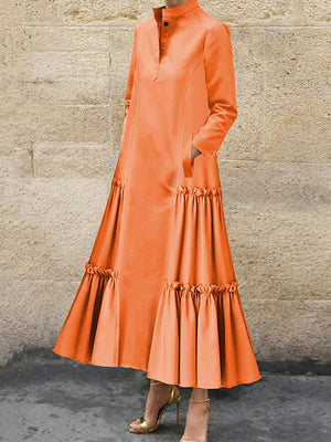 Robe longue boutonnée superposée plissée volantée coupe trapèze, à manches longues, à poches, à empiècements, à col montant, couleur unie