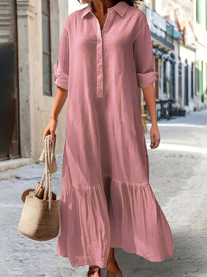 Robe longue boutonnée plissée coupe trapèze, à manches longues, à empiècements, à col revers, couleur unie