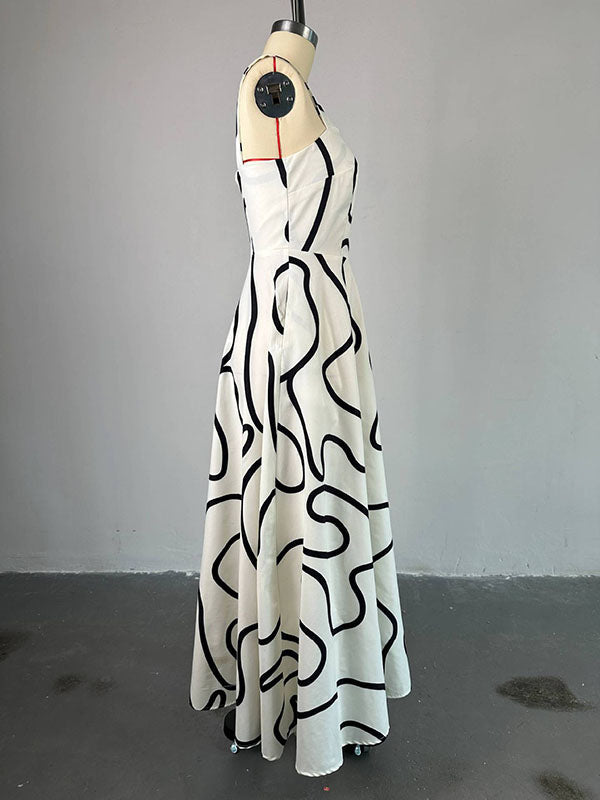 Robe longue imprimée coupe trapèze, taille haute, à poches, à empiècements, à fines bretelles