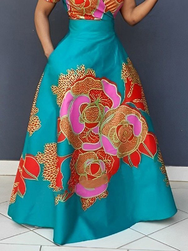Robe de soirée longue ample coupe trapèze, à imprimé floral, à empiècements, à décolleté en V profond
