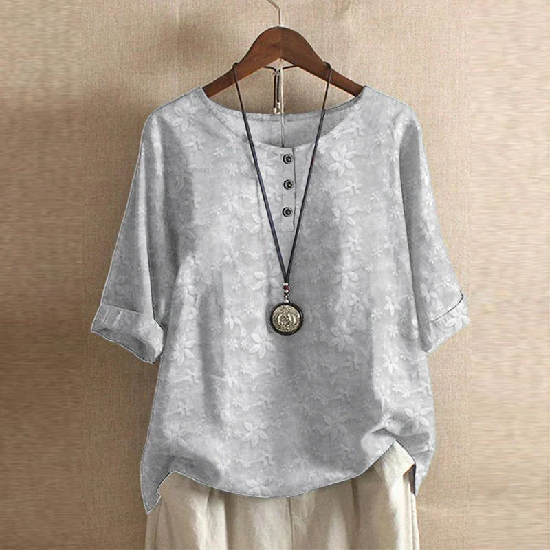 Blouse chemise pour femmes avec encolure ronde, manches mi-longues, patte de boutonnage et poignets retroussés