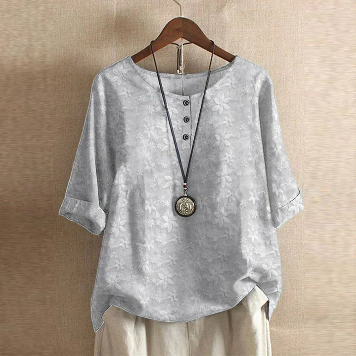 Blouse chemise pour femmes avec encolure ronde, manches mi-longues, patte de boutonnage et poignets retroussés