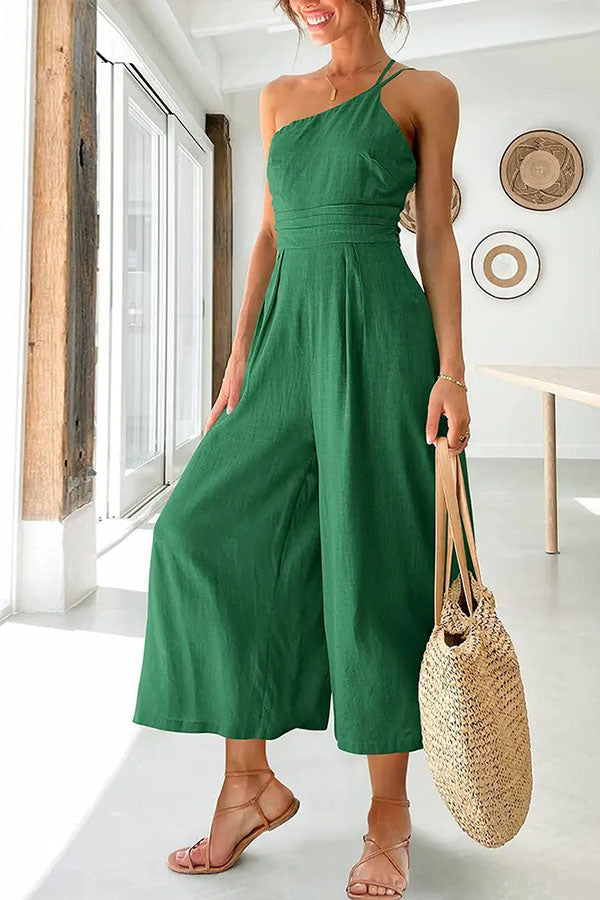Combinaison pour femmes avec bretelle asymétrique et jambes larges