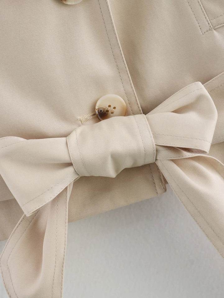 Veste courte pour femmes avec double rangée de boutons et ceinture à nouer