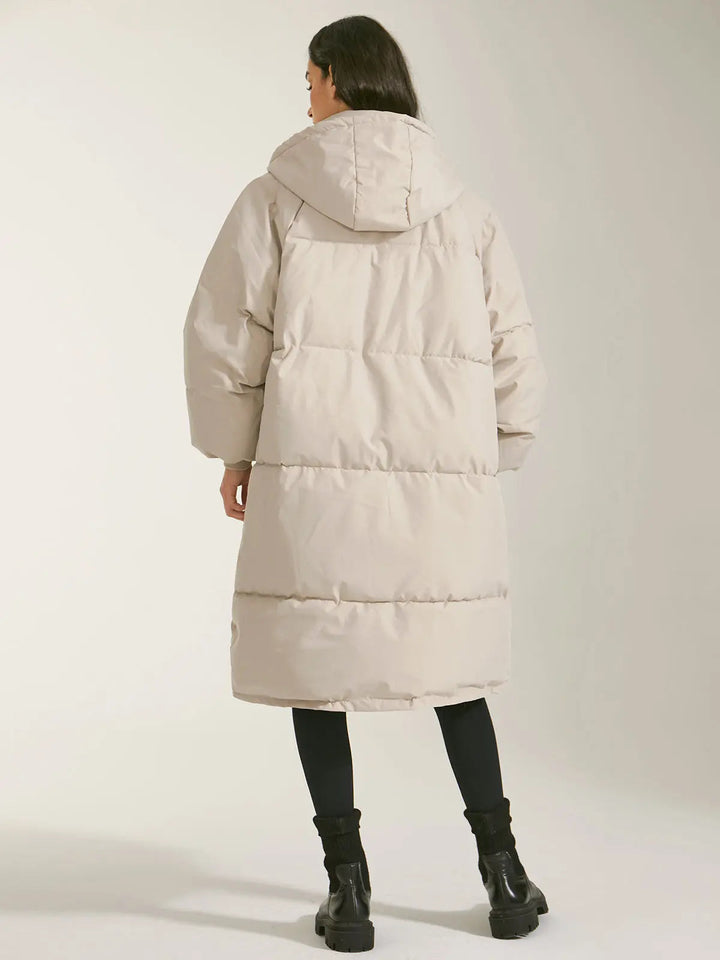 Manteau Long Matelassé pour Femmes avec Capuche, Fermeture Frontale et Poches Latérales
