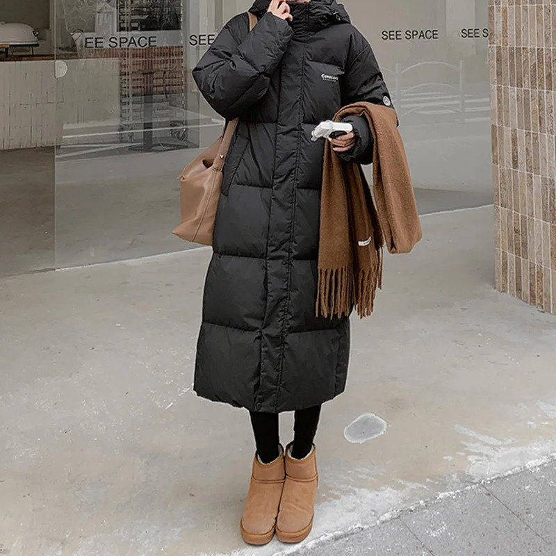 Manteau Long Matelassé pour Femmes avec Capuche et Fermeture Éclair Frontale et Poches Latérales