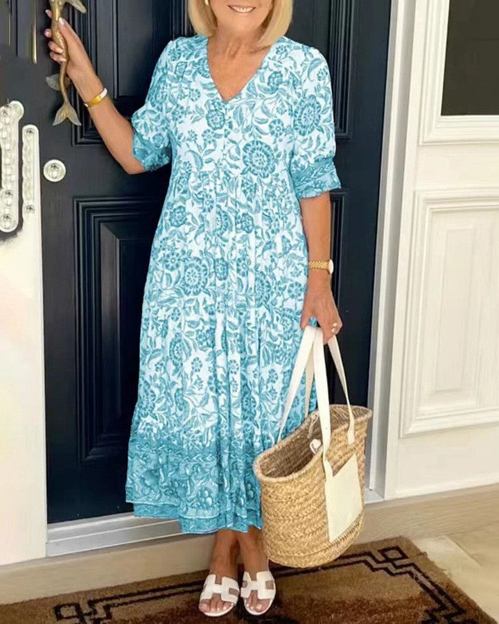 Robe maxi femme avec décolleté en V, patte de boutonnage et motif floral