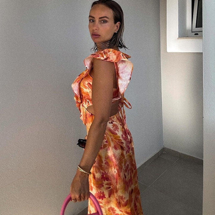 Robe maxi femme avec décolleté en V et bretelles volantées avec découpes latérales et motif floral