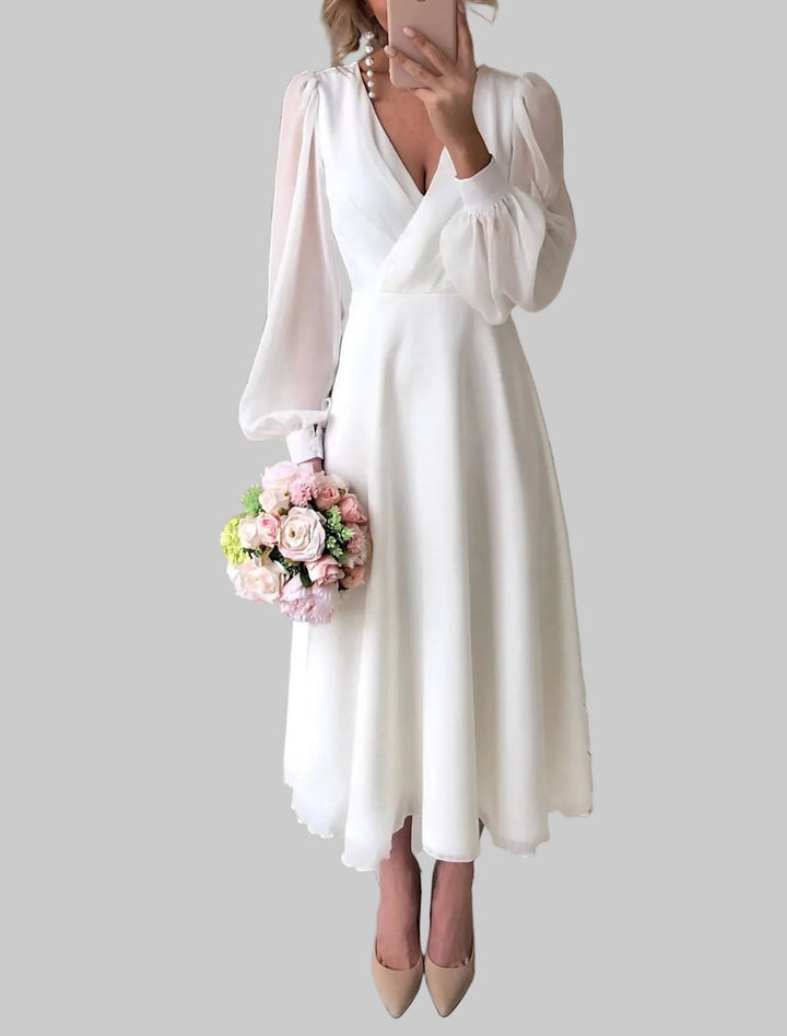 Robe midi femme avec décolleté en V profond, manches ballons longues et jupe évasée