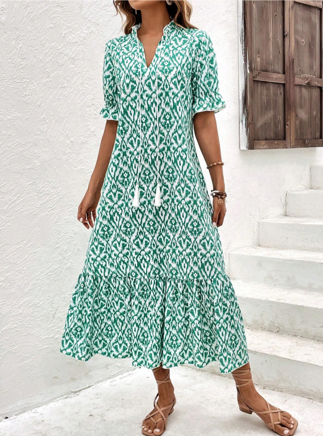 Robe midi femme avec décolleté en V et cordons à pompons, manches bouffantes courtes et jupe à volants