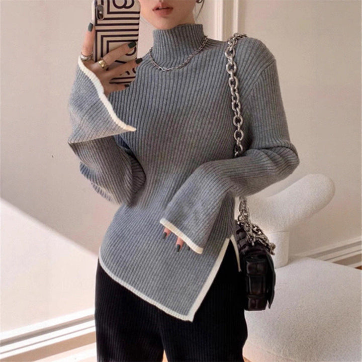 Pull femme avec col roulé, manches longues, passepoil contrasté et fente sur le côté