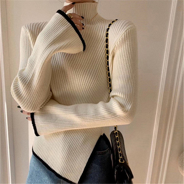 Pull femme avec col roulé, manches longues, passepoil contrasté et fente sur le côté