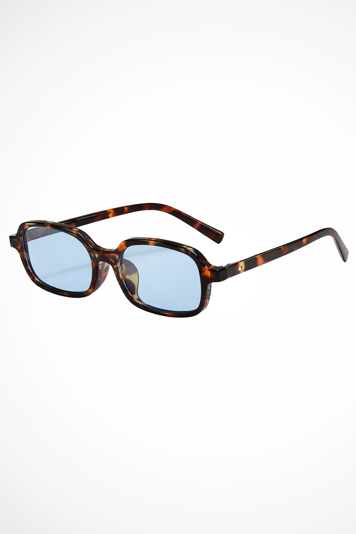 Lunettes de soleil pour femmes avec monture rectangulaire et coins biseautés