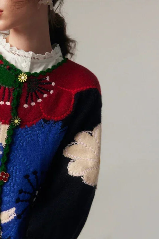 Gilet pour femmes avec boutonnière et motif floral en relief ainsi que bord en arc