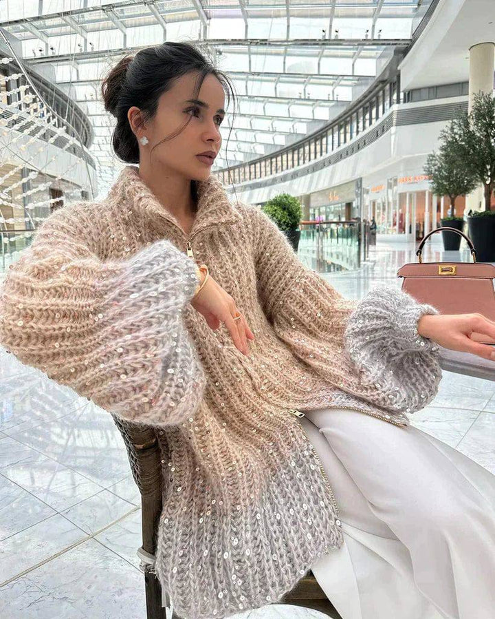 Veste en tricot pour femmes avec fermeture éclair et col montant ainsi que garniture en sequins