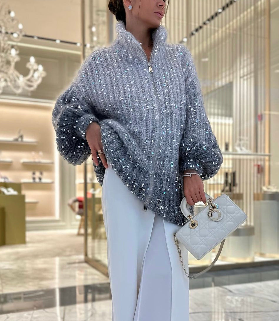 Veste en tricot pour femmes avec fermeture éclair et col montant ainsi que garniture en sequins