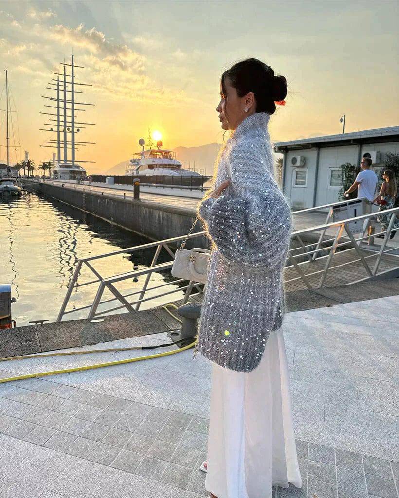 Veste en tricot pour femmes avec fermeture éclair et col montant ainsi que garniture en sequins