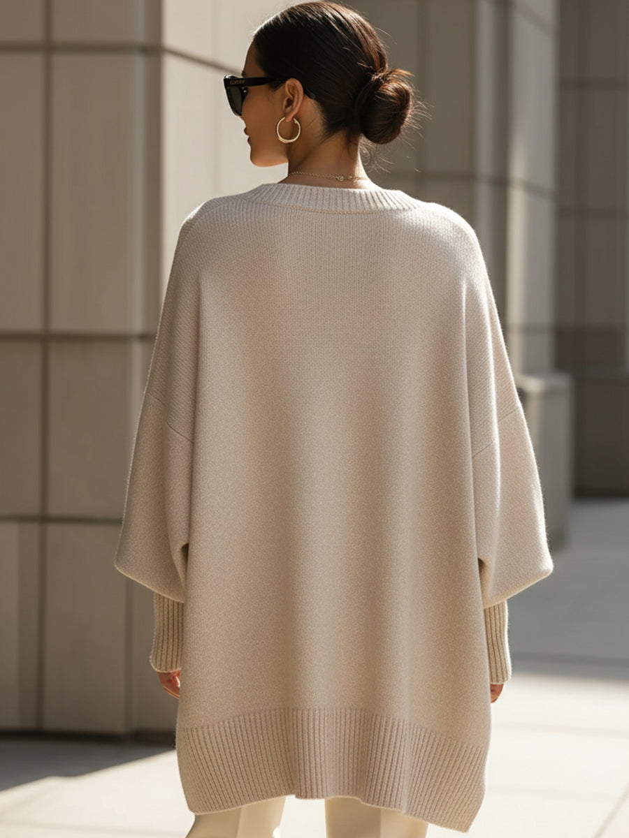 Pull en tricot pour femmes avec col rond et manches chauve-souris ainsi qu'un ourlet en côtes