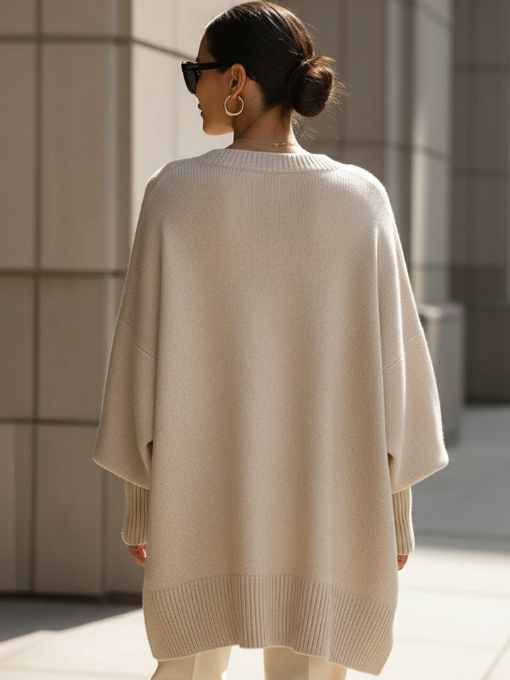 Pull en tricot pour femmes avec col rond et manches chauve-souris ainsi qu'un ourlet en côtes