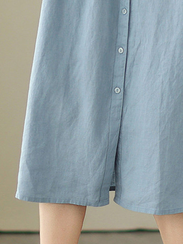 Robe mi-longue boutonnée plissée coupe trapèze, sans manches, à col rond, couleur unie