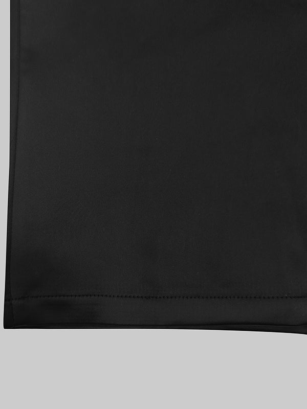 Robe mi-longue boutonnée à manches longues, à manches bouffantes, à décolleté en V profond, couleur unie