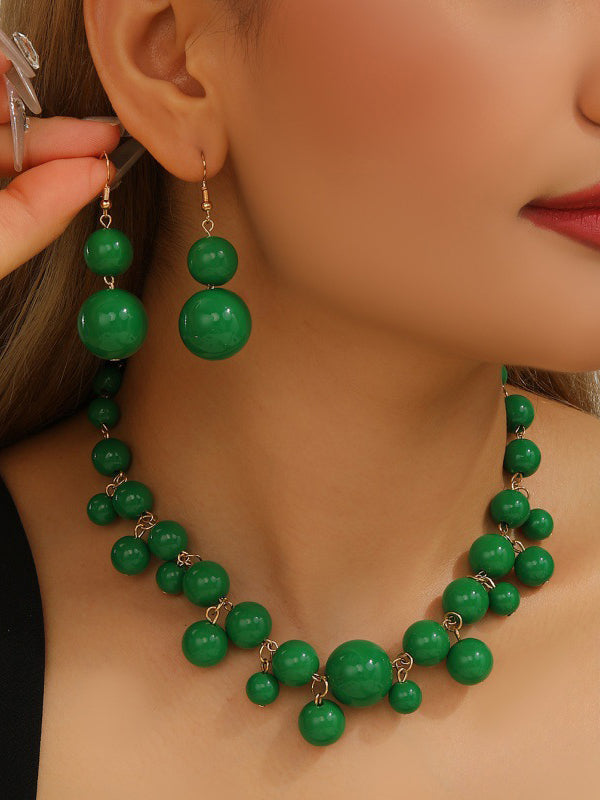 Parure collier et boucles d'oreilles à empiècements