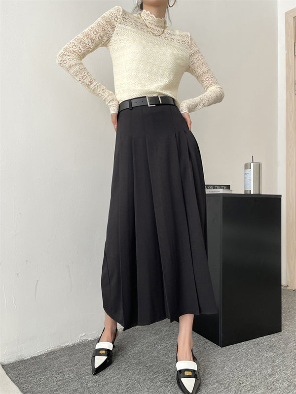 Jupe plissée coupe trapèze, taille haute, à empiècements, couleur unie