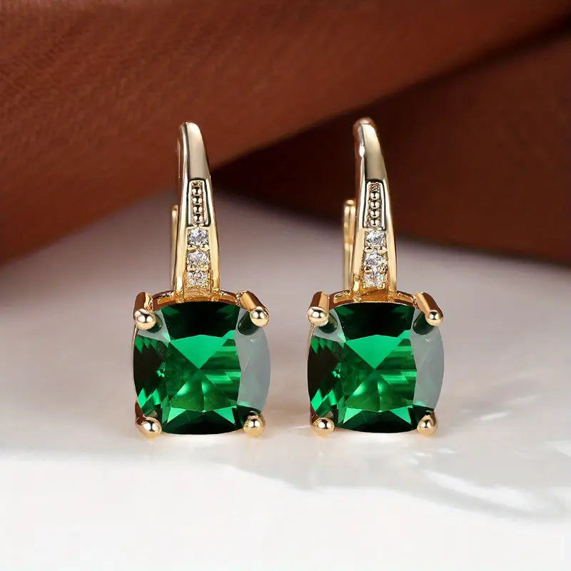 Boucles d'oreilles dorées avec cercle de pierre mystique