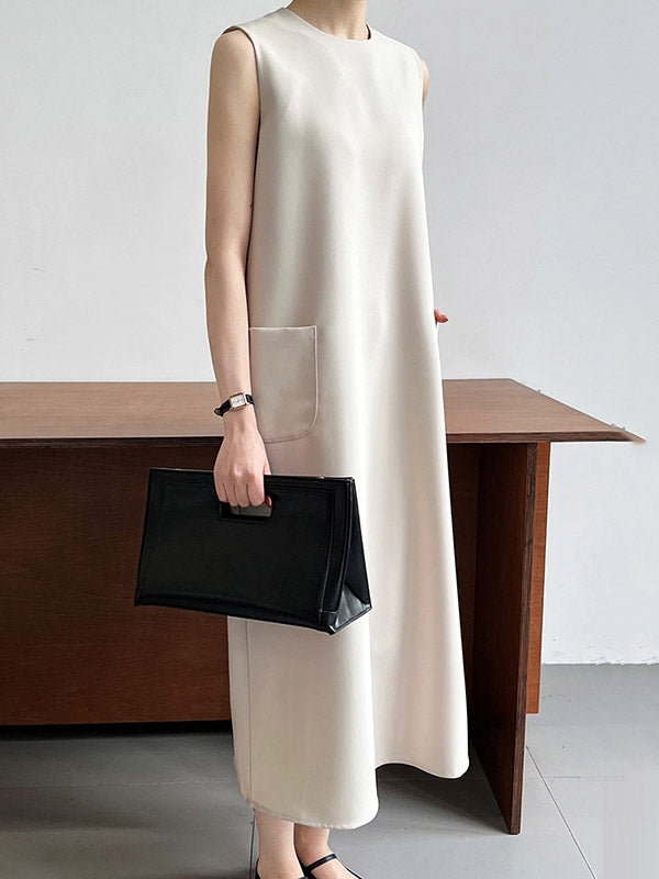 Robe mi-longue ample fendue dans le dos taille haute, à poches, à fermeture éclair, à col rond, couleur unie