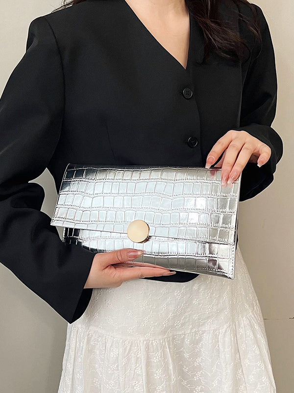 Sac à main géométrique brillant à empiècements