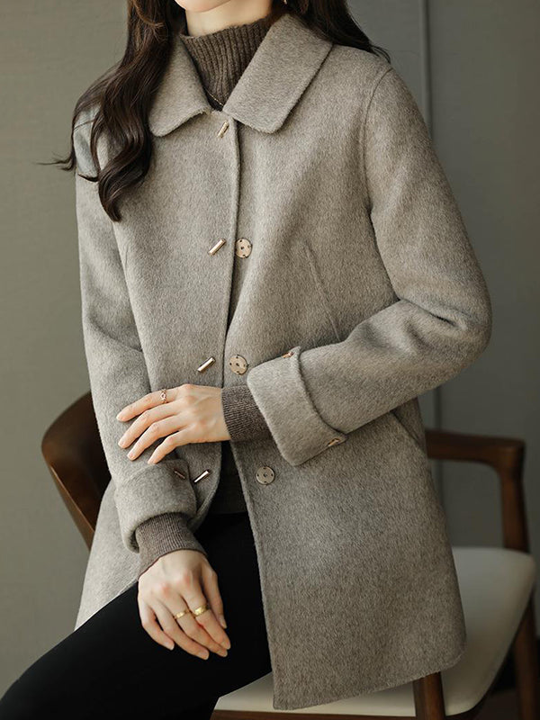 Manteau en laine ample boutonné à manches longues, à poches, à col revers, couleur unie