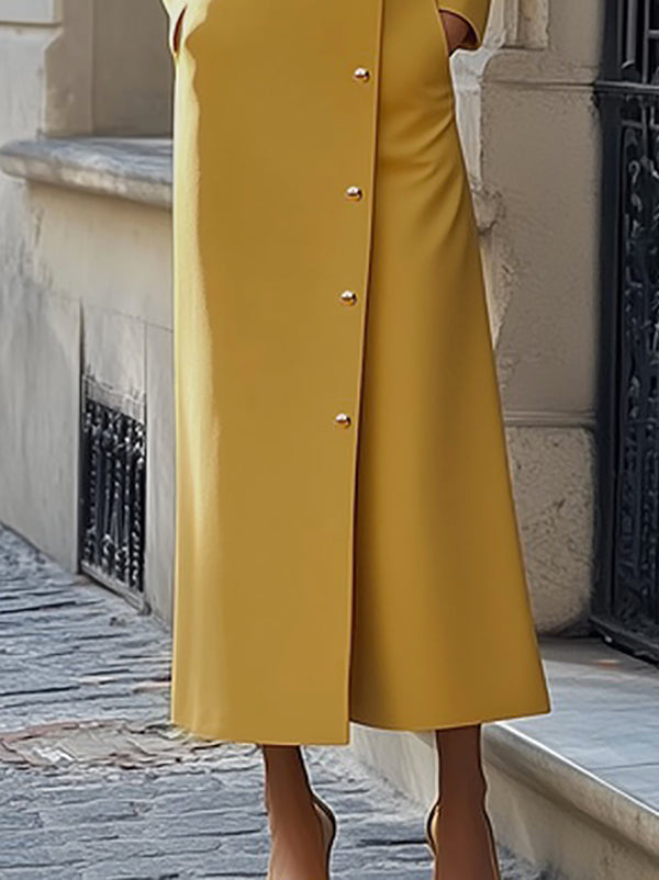 Robe longue ample boutonnée à manches longues, à poches, à empiècements, à col montant, couleur unie