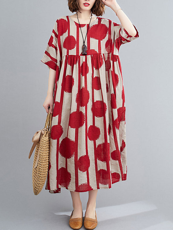 Robe mi-longue à pois, à empiècements, à col rond