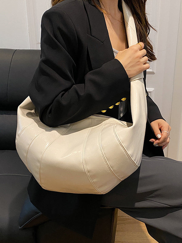 Sac bandoulière géométrique à empiècements, à fermeture éclair