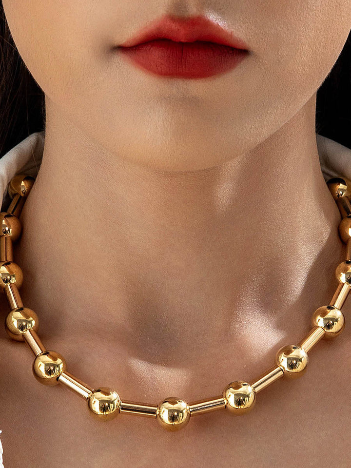 Parure collier et boucles d'oreilles géométrique couleur unie