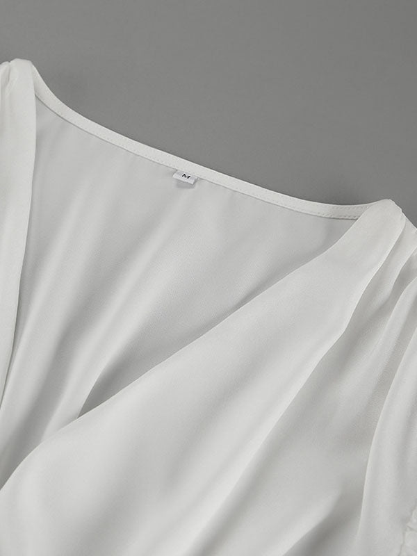 Chemisier ample plissé à manches bouffantes, à taille élastique, à empiècements, à col en V, couleur unie